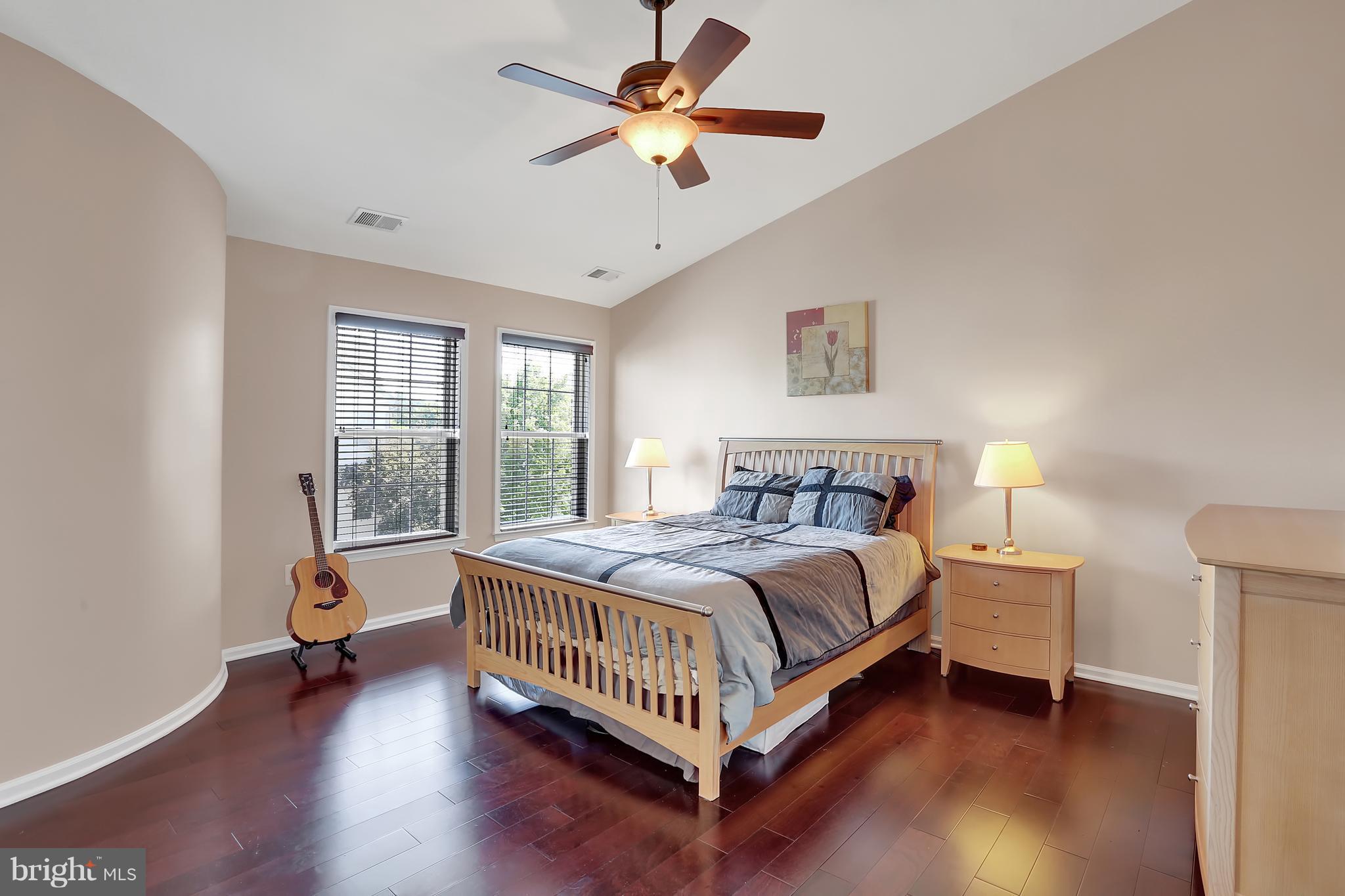 20693 Riptide Square Sterling, VA 20165 - Photo 5 of 30 a bed room with a bed and a chair