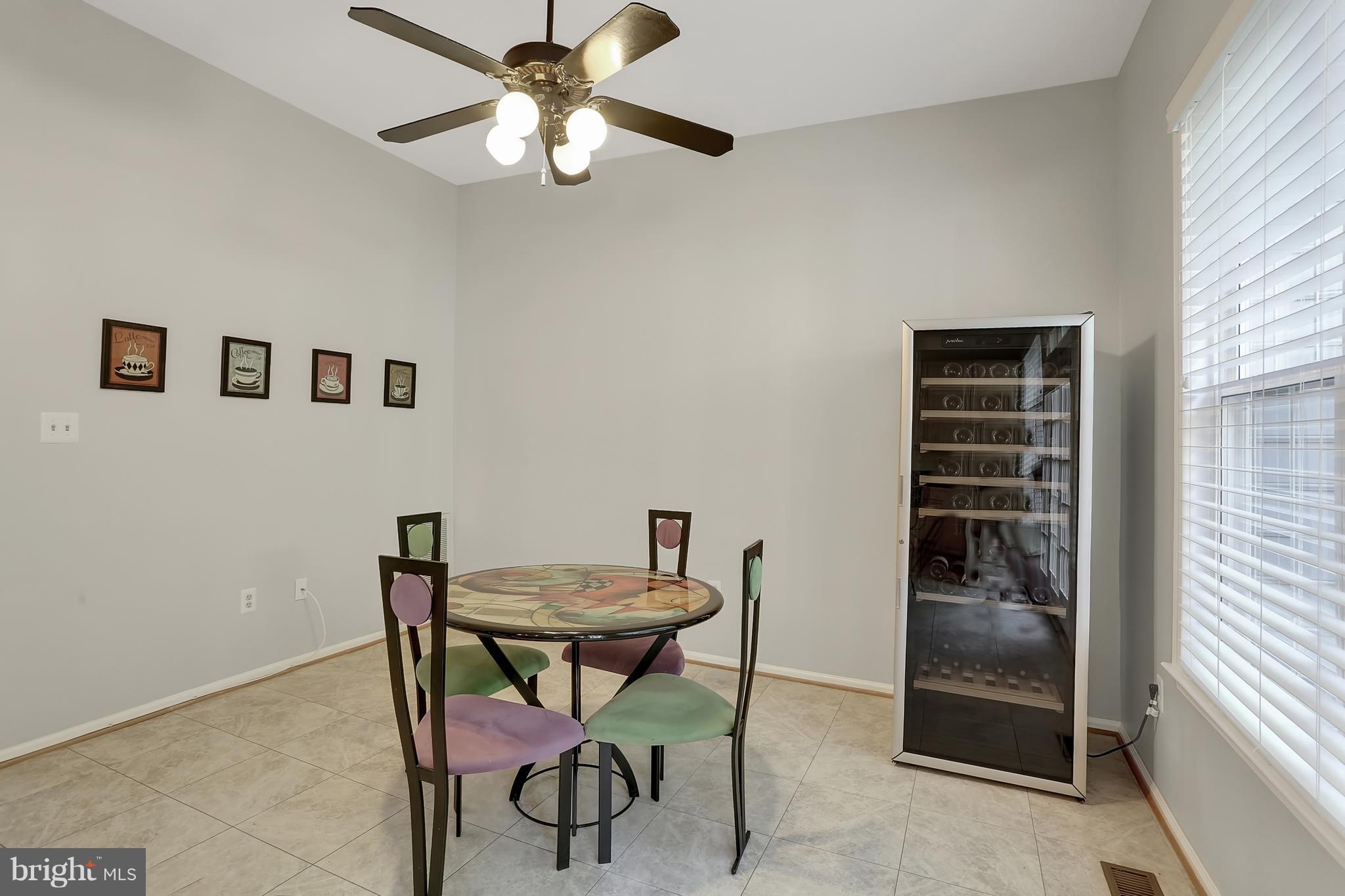 20693 Riptide Square Sterling, VA 20165 - Photo 7 of 30 a view of a dining room with furniture and a window