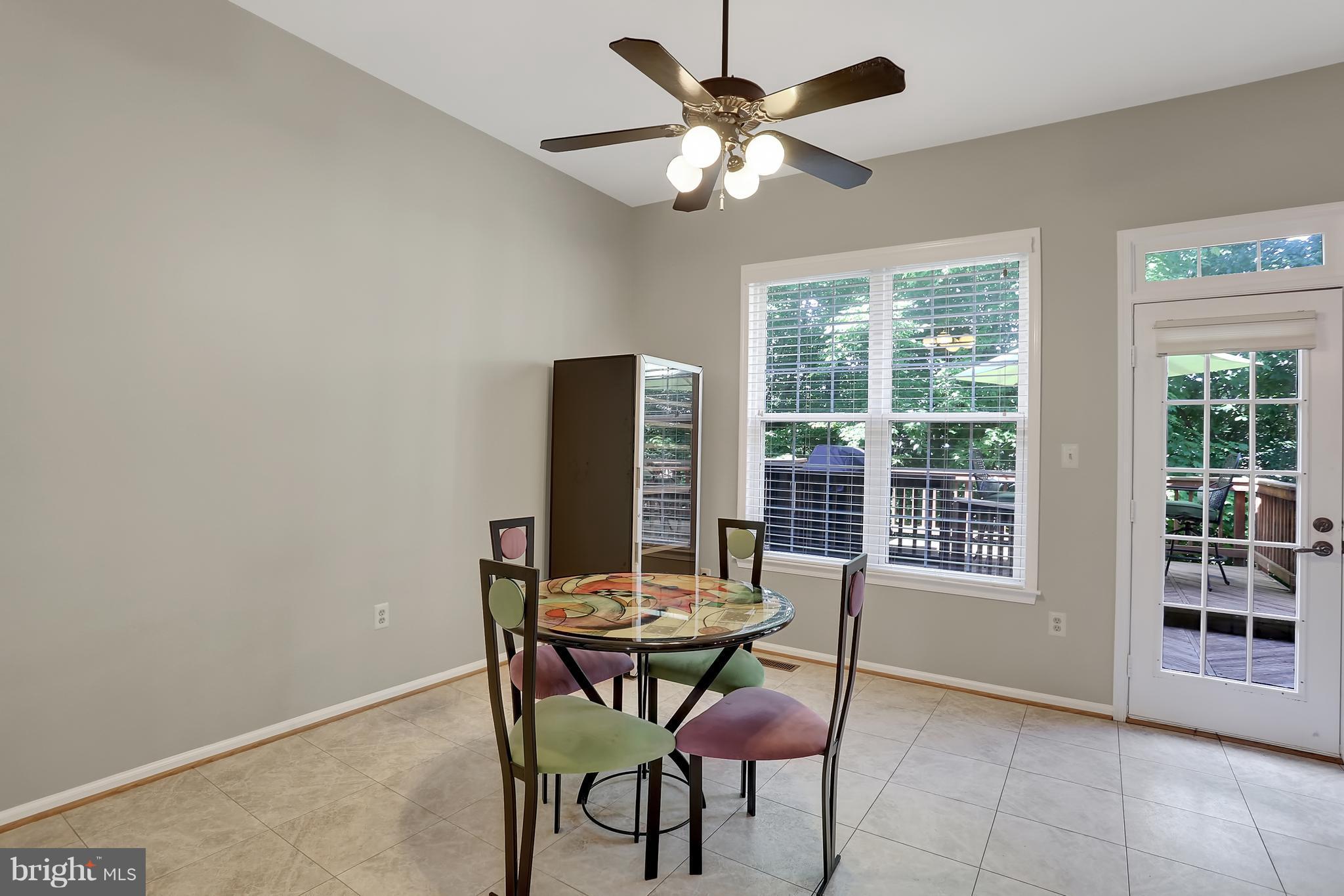 20693 Riptide Square Sterling, VA 20165 - Photo 8 of 30 a view of a dining room with furniture and window