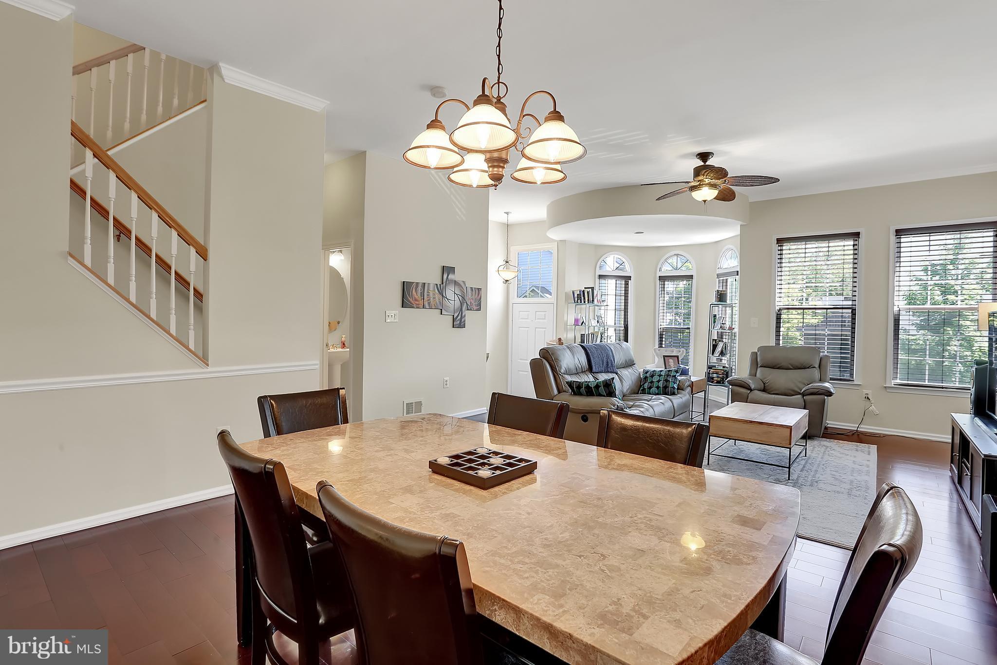 20693 Riptide Square Sterling, VA 20165 - Photo 9 of 30 a view of a dining room with furniture and chandelier