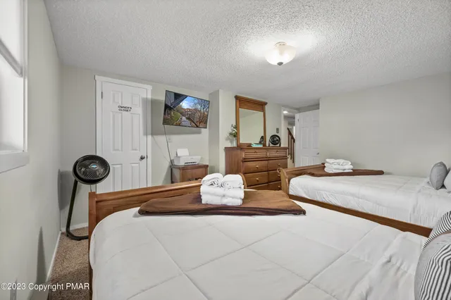 a bedroom with bed and window