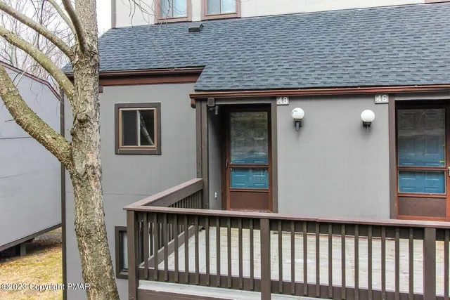a view of a brick house with a large window