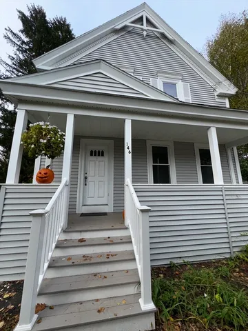 a front view of a house with a porch