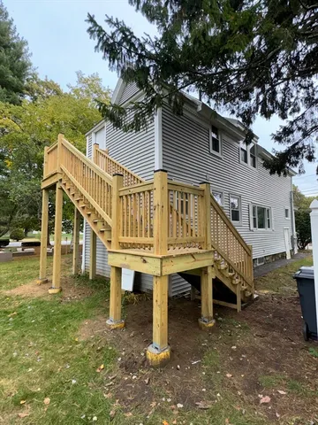 a view of a house with a yard porch and sitting area