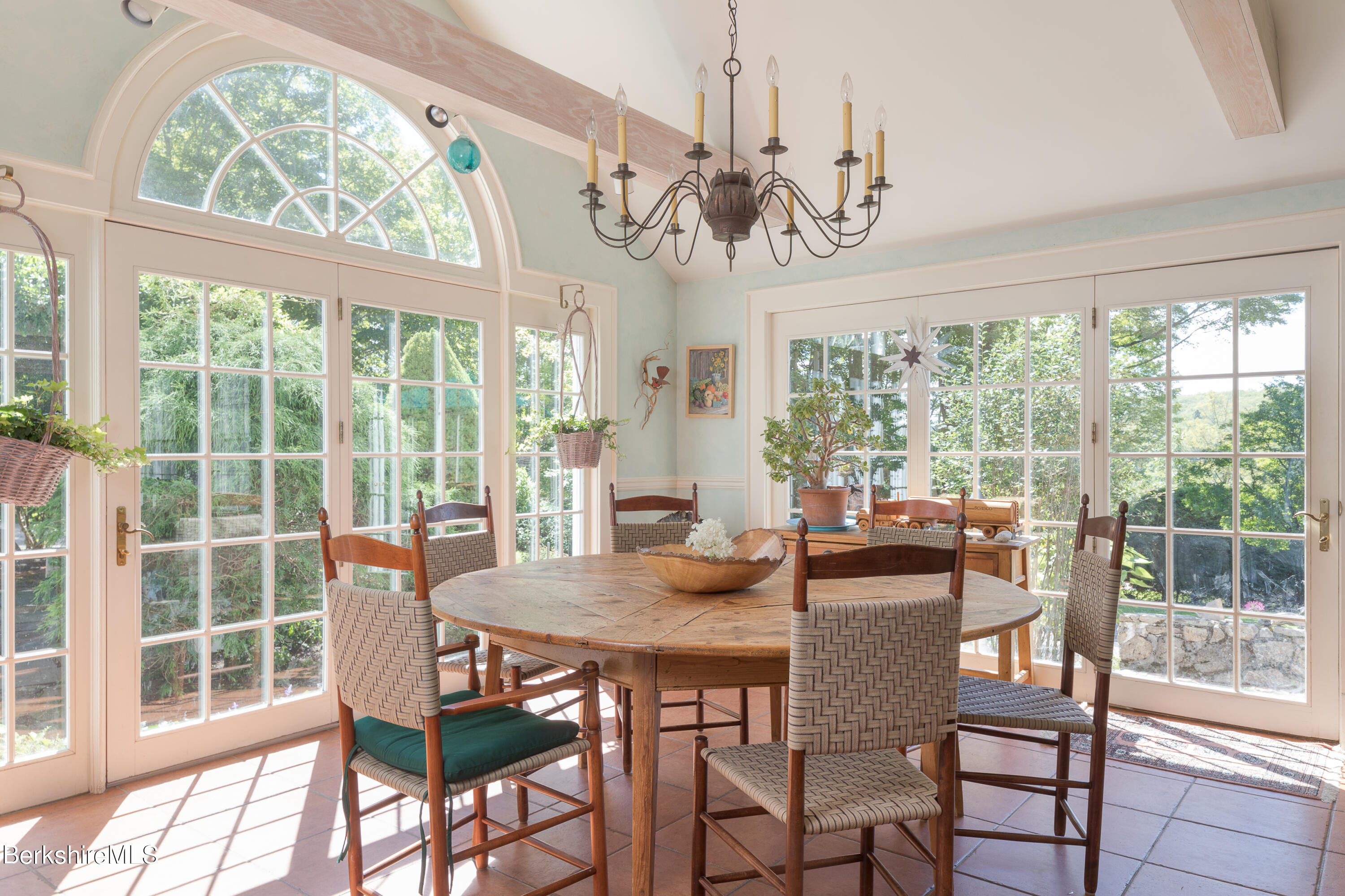 73 Scoville Road Cornwall, CT 06796 - Photo 12 of 26 a view of a dining room with furniture large windows and wooden floor