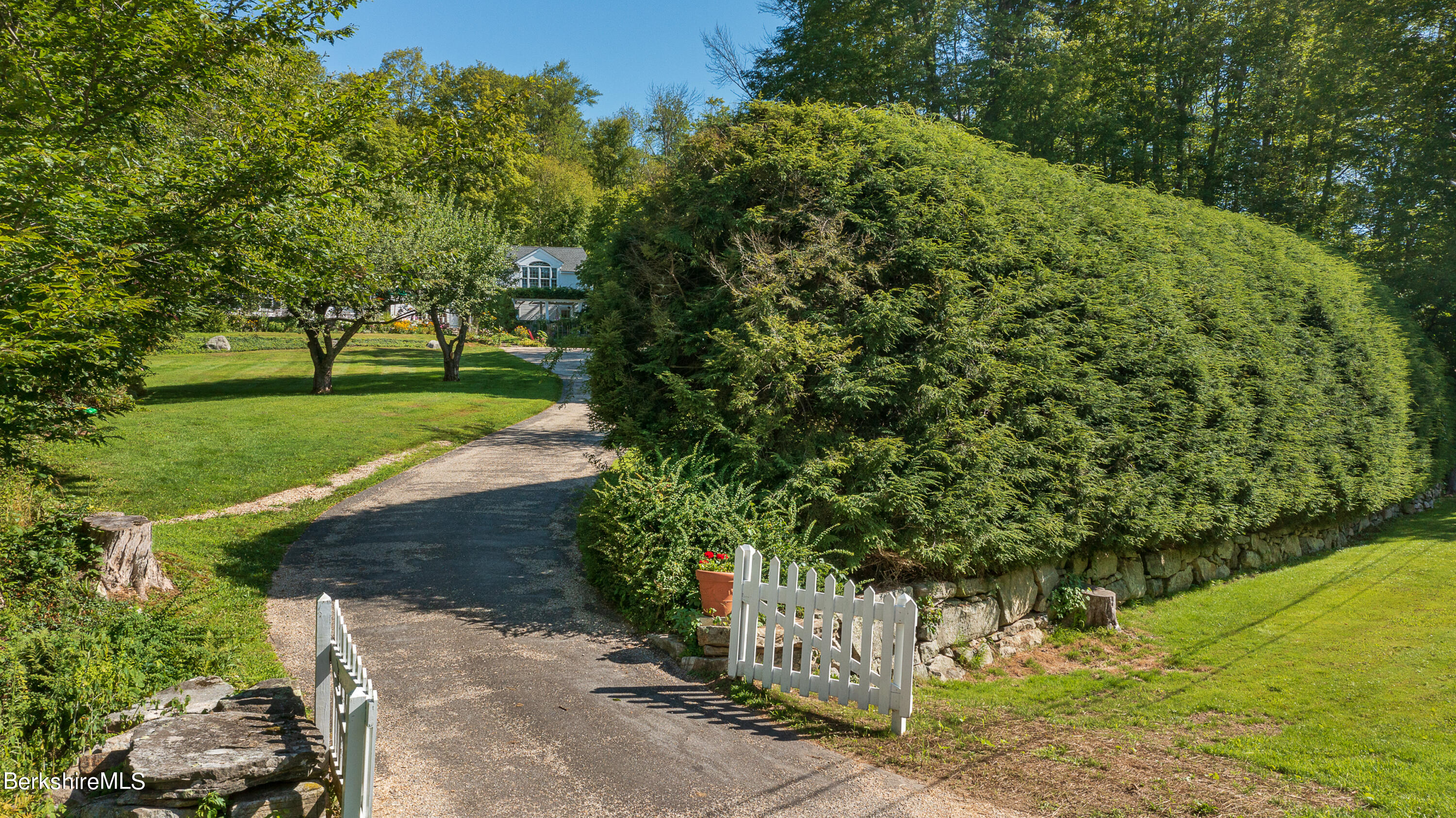 73 Scoville Road Cornwall, CT 06796 - Photo 21 of 26 a view of a street with a bench