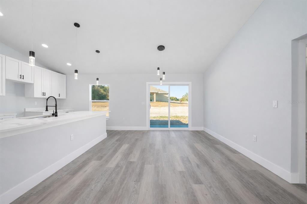 13750 Southwest 113th Lane Dunnellon, FL 34432 - Photo 6 of 26 a view of a kitchen with wooden floor and a sink