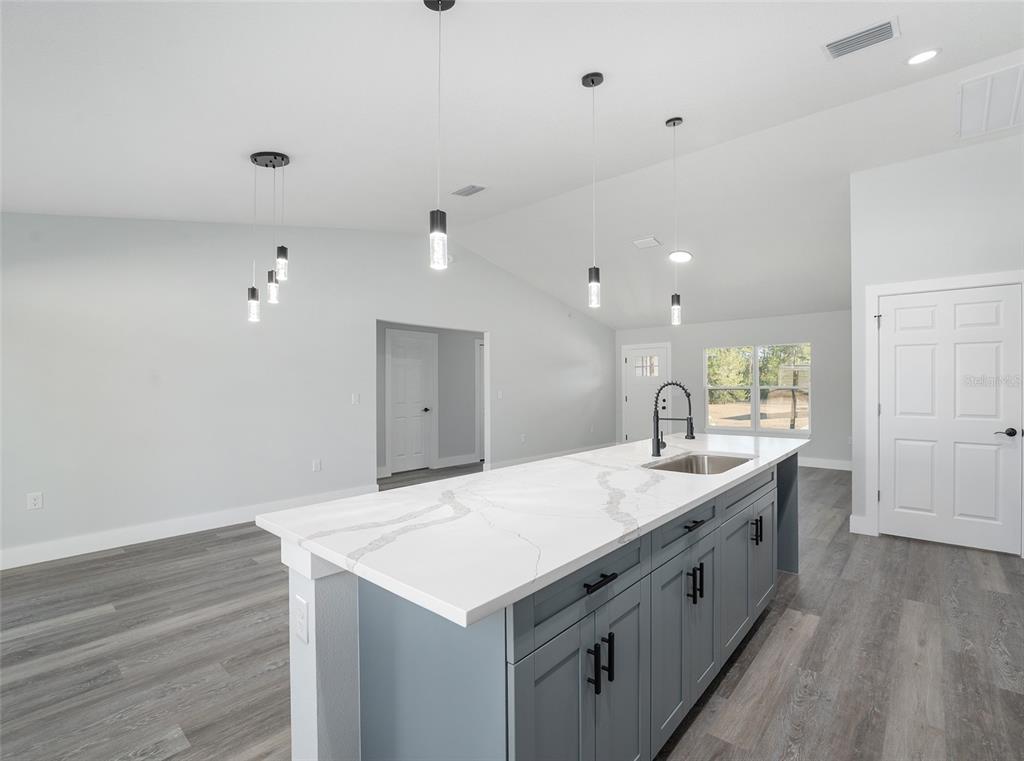 13750 Southwest 113th Lane Dunnellon, FL 34432 - Photo 9 of 26 a large white kitchen with a sink and dishwasher