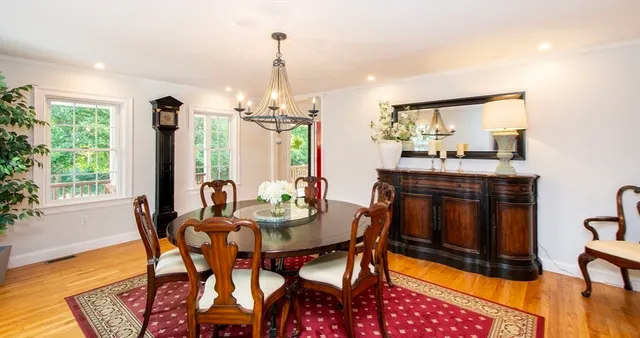 a balcony with table and chairs