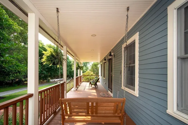 a living room with furniture a fireplace and a table