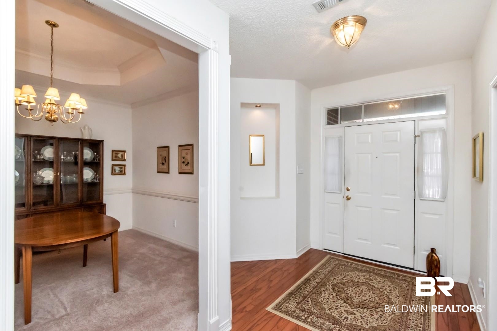1032 Cross Gates Place Mobile, AL 36609 - Photo 2 of 34 Entryway featuring a chandelier, hardwood / wood-style floors, and a raised ceiling