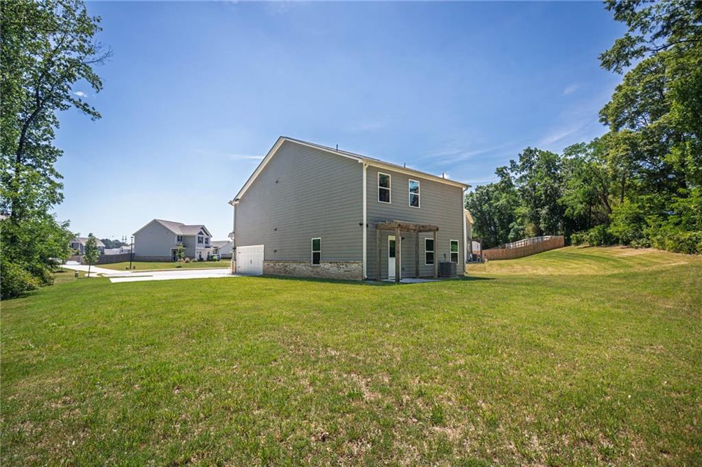 635 Meadows Farm Way Monroe, GA 30655 - Photo 35 of 36 a house view with a garden space