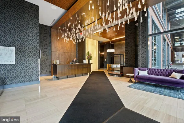 a lobby with furniture and window