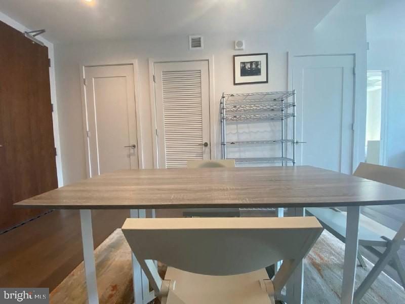 45 Sutton Square Southwest, Unit 1111 Washington, DC 20024 - Photo 4 of 20 a view of a dining room with furniture and window