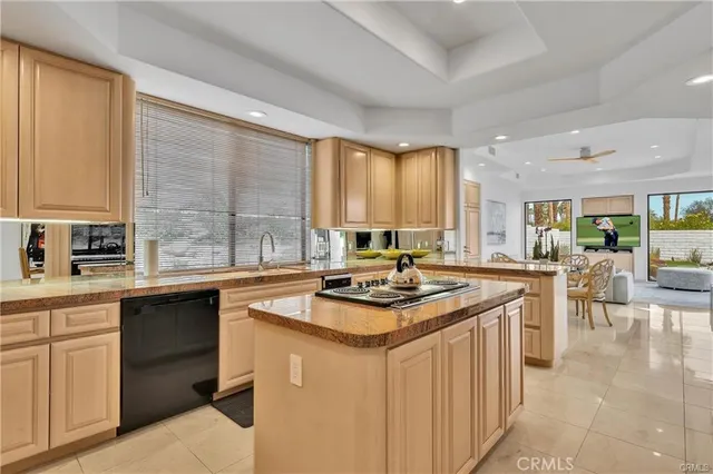 a kitchen with wooden cabinets and a stove top oven