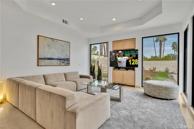 a utility room with stainless steel appliances granite countertop a sink and a stove