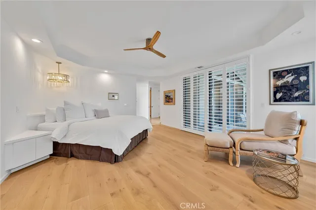 a bathroom with a tub a sink and mirror