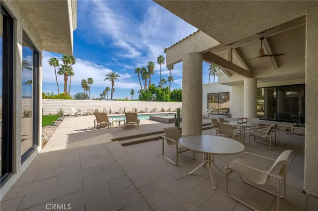 a backyard of a house with seating space