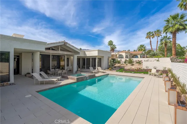 a view of a house with swimming pool