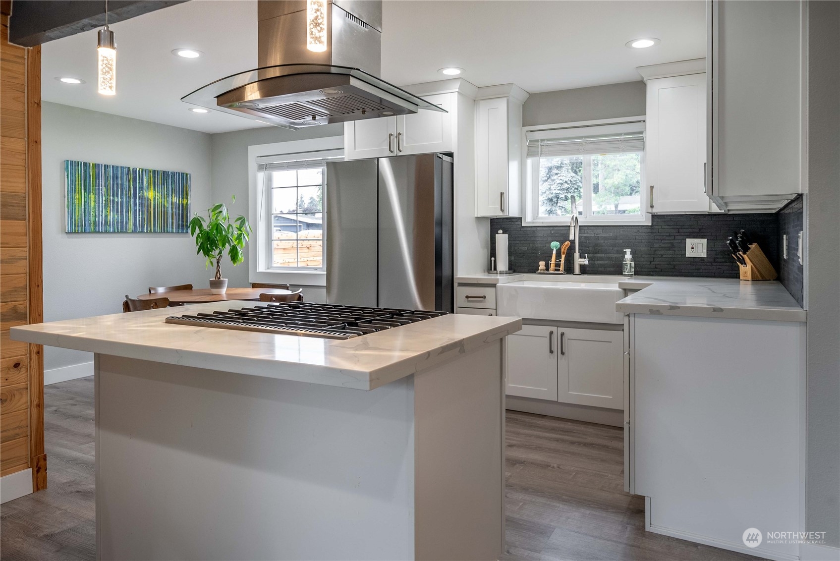17920 91st Place Northeast Bothell, WA 98011 - Photo 15 of 39 a kitchen with kitchen island granite countertop a sink stainless steel appliances and window
