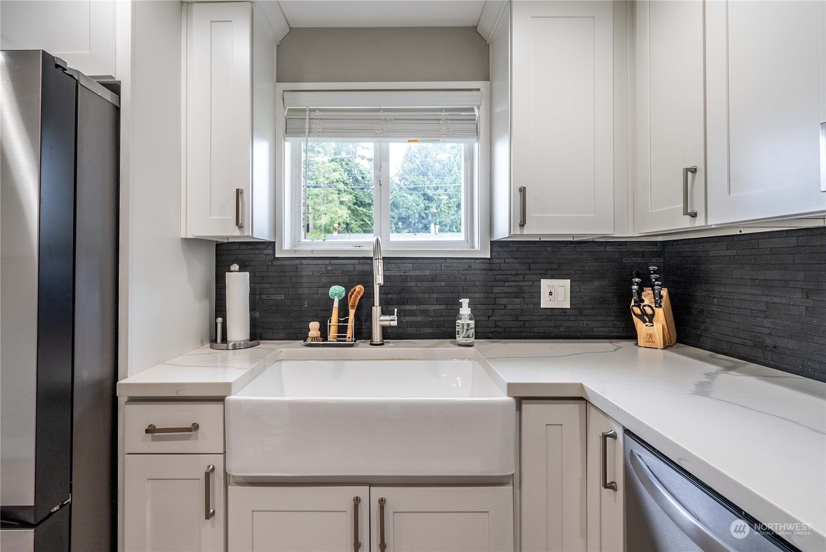 17920 91st Place Northeast Bothell, WA 98011 - Photo 16 of 39 a kitchen with a sink cabinets and a window