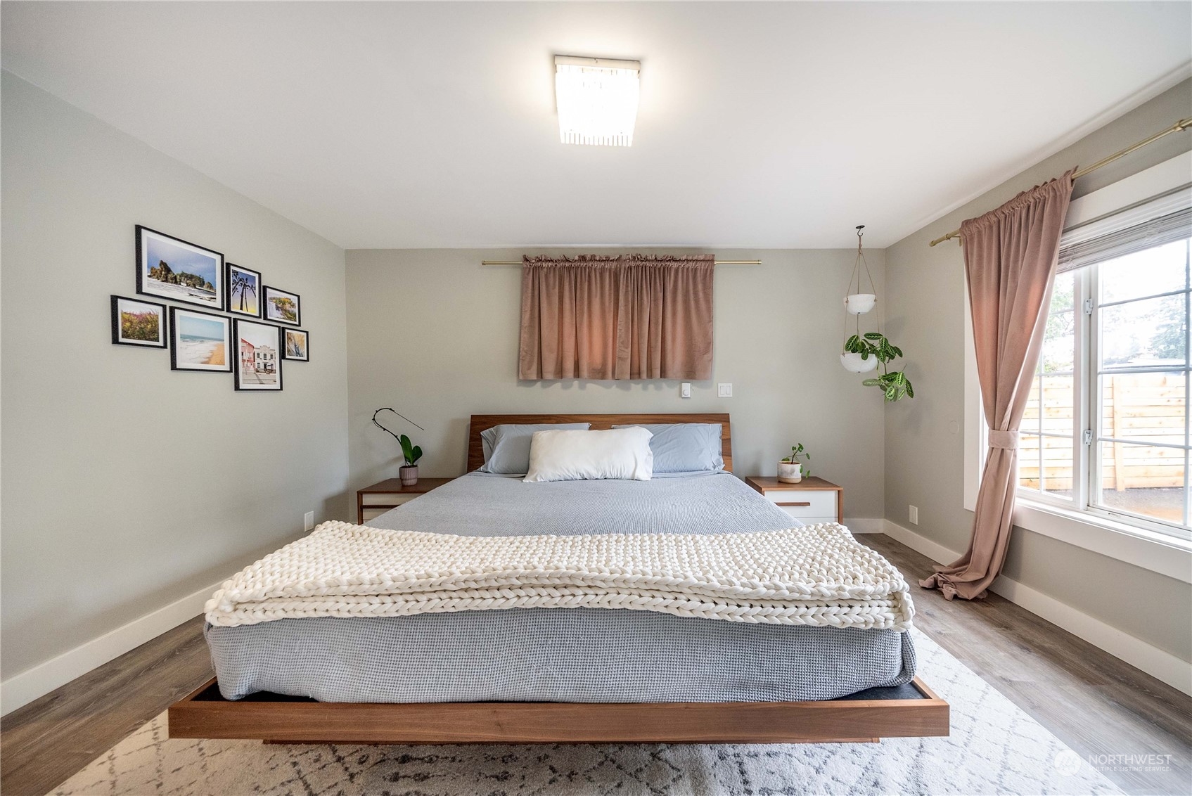 17920 91st Place Northeast Bothell, WA 98011 - Photo 20 of 39 a bedroom with a bed and wooden floor