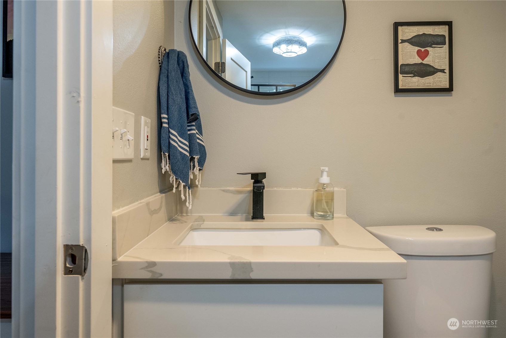 17920 91st Place Northeast Bothell, WA 98011 - Photo 22 of 39 a bathroom with a sink and a mirror