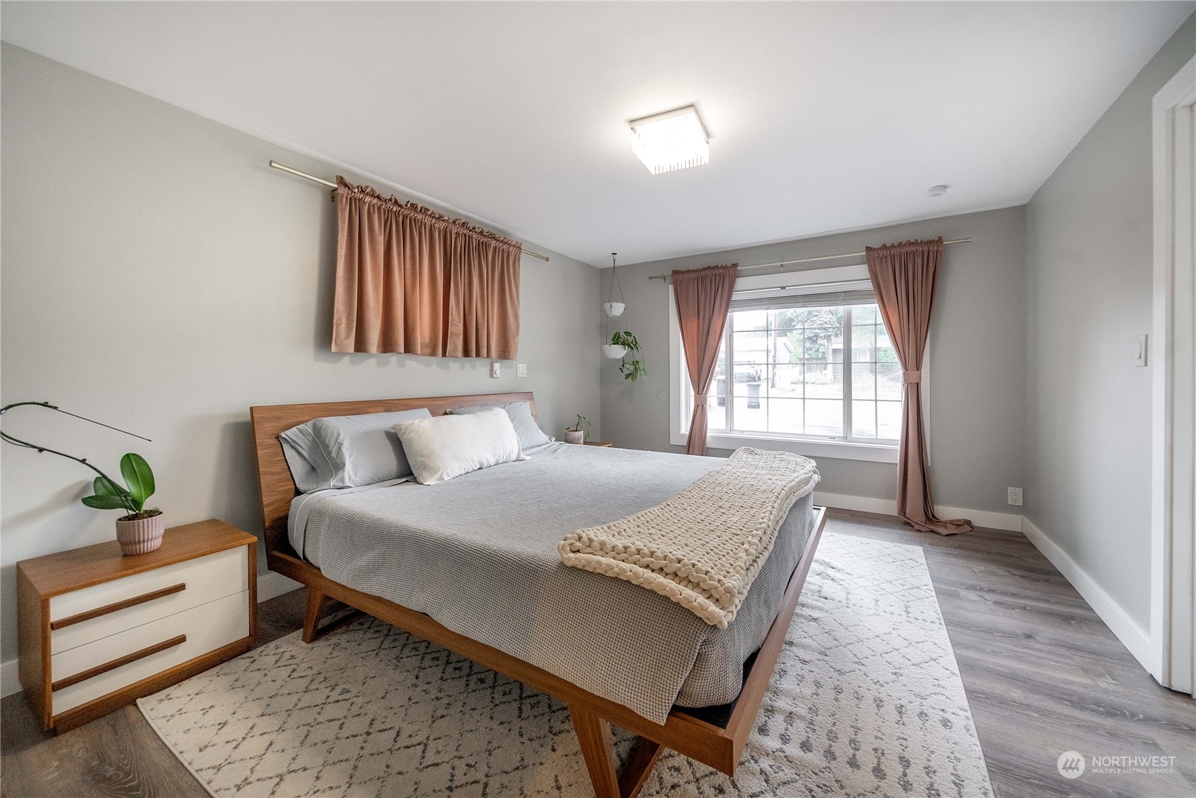 17920 91st Place Northeast Bothell, WA 98011 - Photo 23 of 39 a bedroom with a bed and wooden floor