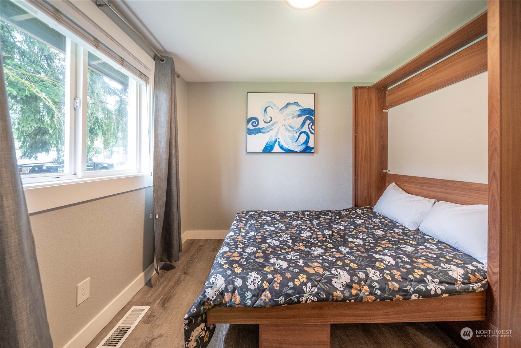 17920 91st Place Northeast Bothell, WA 98011 - Photo 24 of 39 a bedroom with a bed and a window with storage