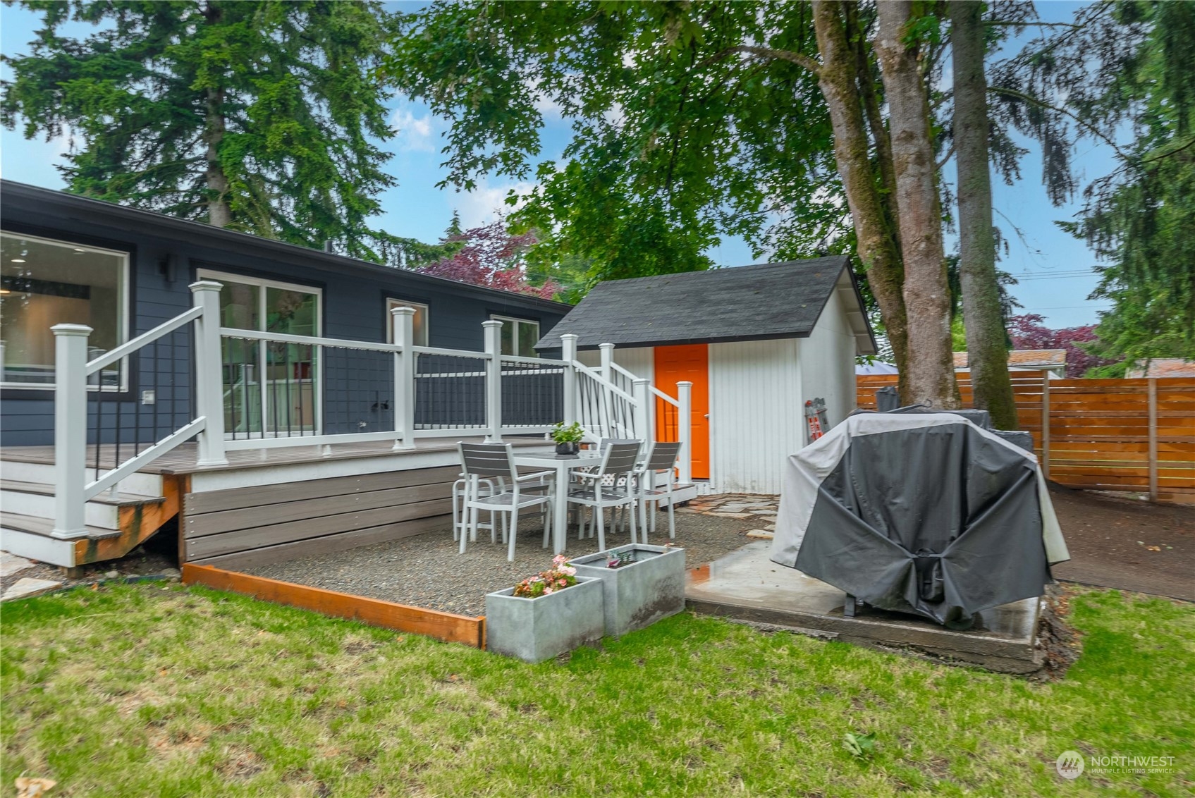 17920 91st Place Northeast Bothell, WA 98011 - Photo 31 of 39 a view of a chair and table in backyard of the house