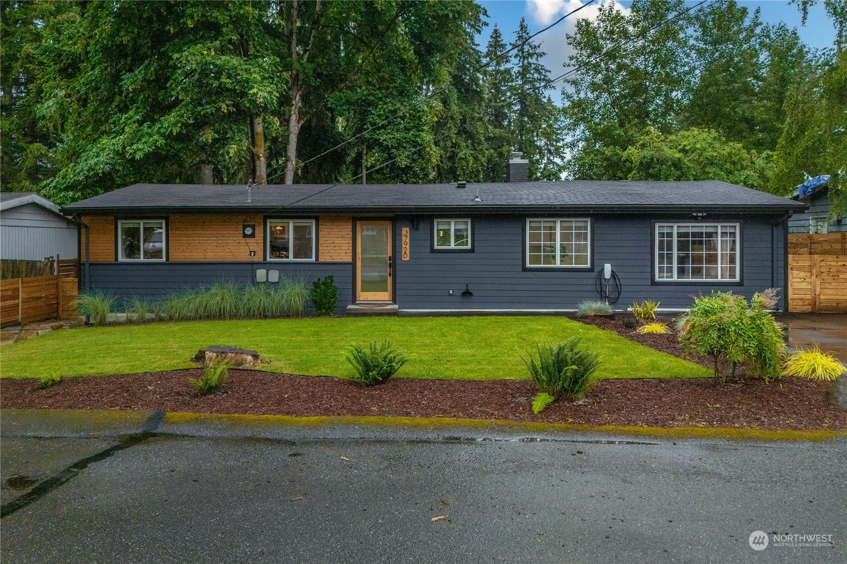 17920 91st Place Northeast Bothell, WA 98011 - Photo 5 of 39 a front view of a house with a yard and a garage