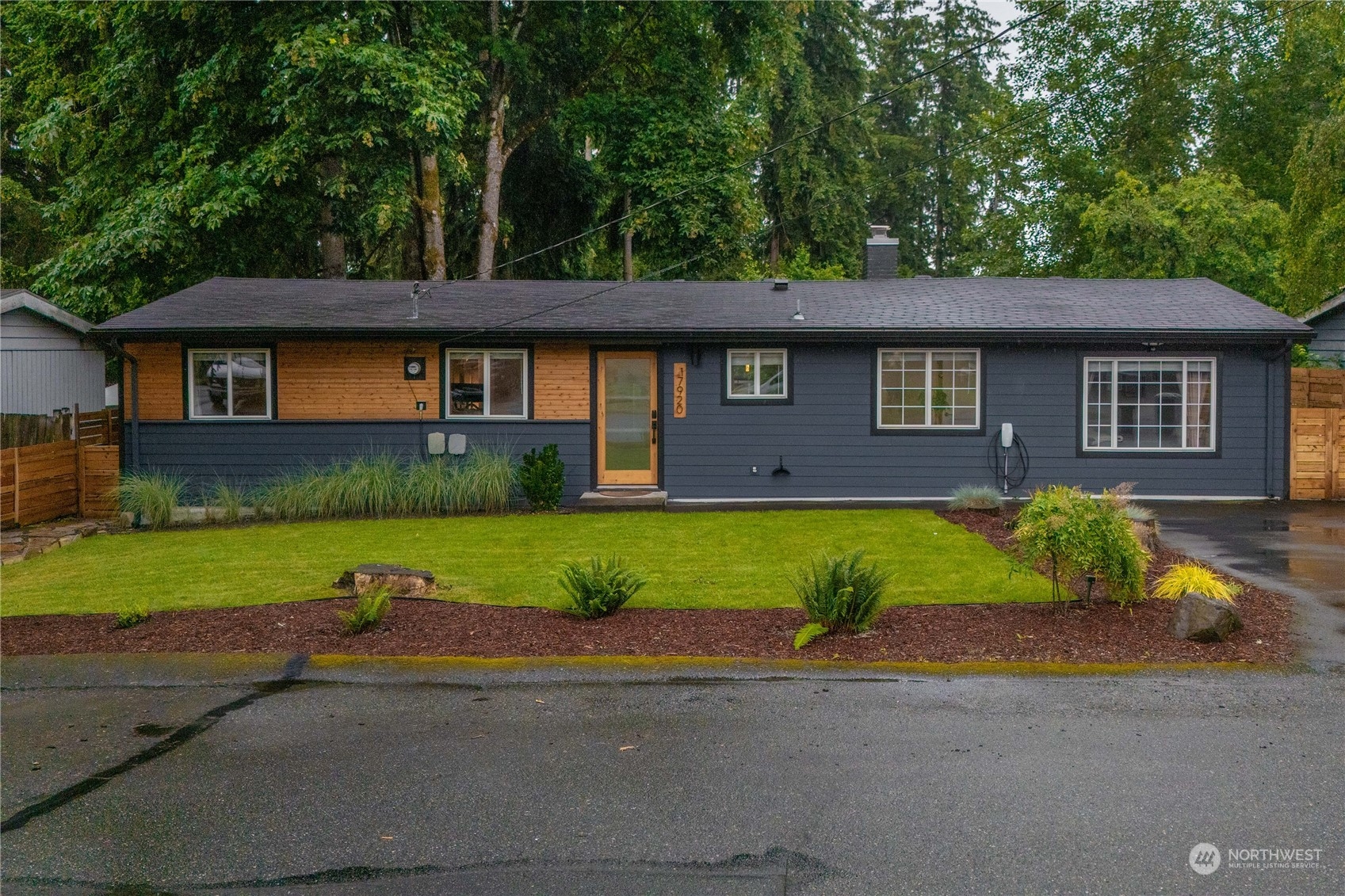 17920 91st Place Northeast Bothell, WA 98011 - Photo 6 of 39 a front view of a house with a yard and garage
