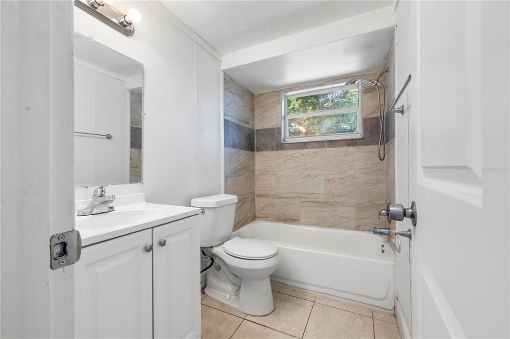 10803 Hyssop Street Port Richey, FL 34668 - Photo 21 of 42 a bathroom with a sink a toilet and a bathtub