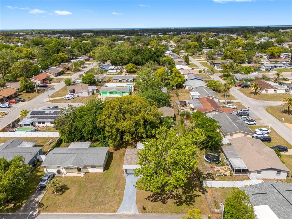 10803 Hyssop Street Port Richey, FL 34668 - Photo 33 of 42 an aerial view of residential houses with outdoor space