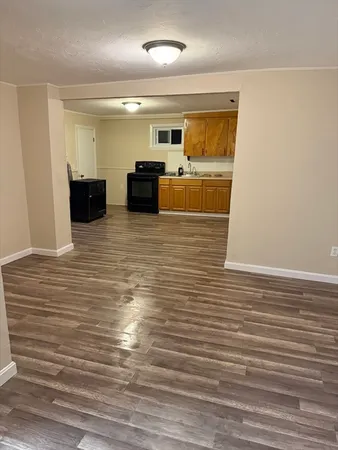 a view of kitchen and empty room
