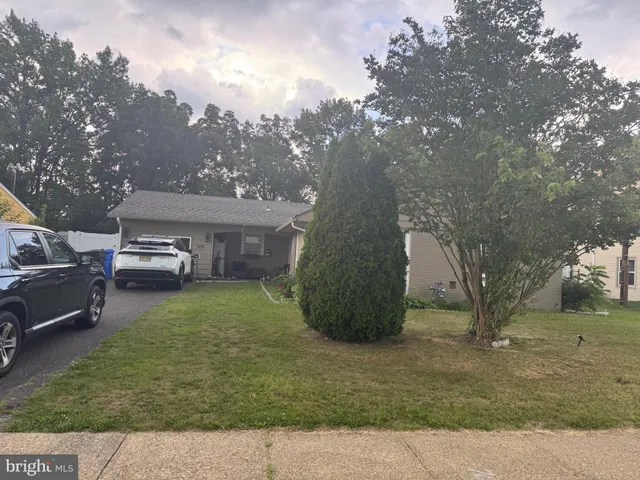 a view of a house with a back yard