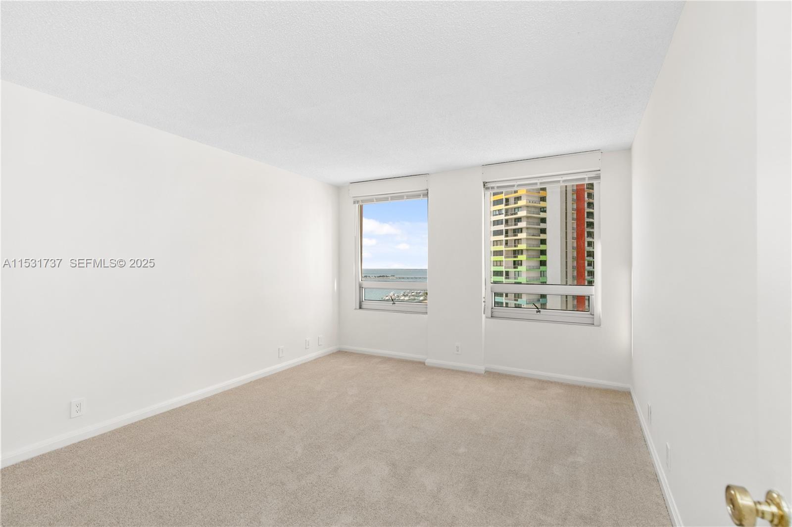 1541 Brickell Avenue, Unit C1507 Miami, FL 33129 - Photo 19 of 69 an empty room with windows