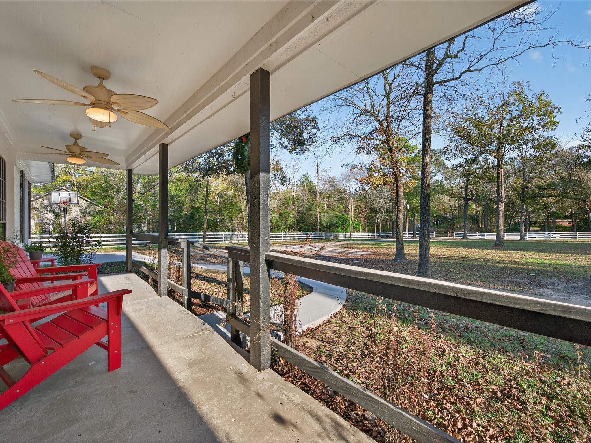 10277 Champion Forest Loop Conroe, TX 77303 - Photo 13 of 45 a view of a porch with furniture and a yard