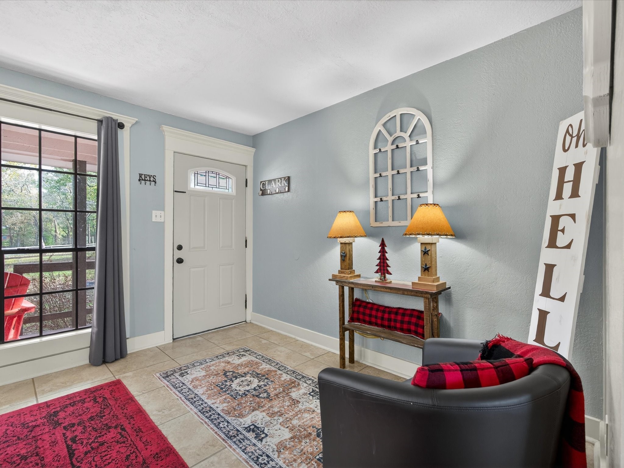 10277 Champion Forest Loop Conroe, TX 77303 - Photo 16 of 45 a living room with furniture and a table