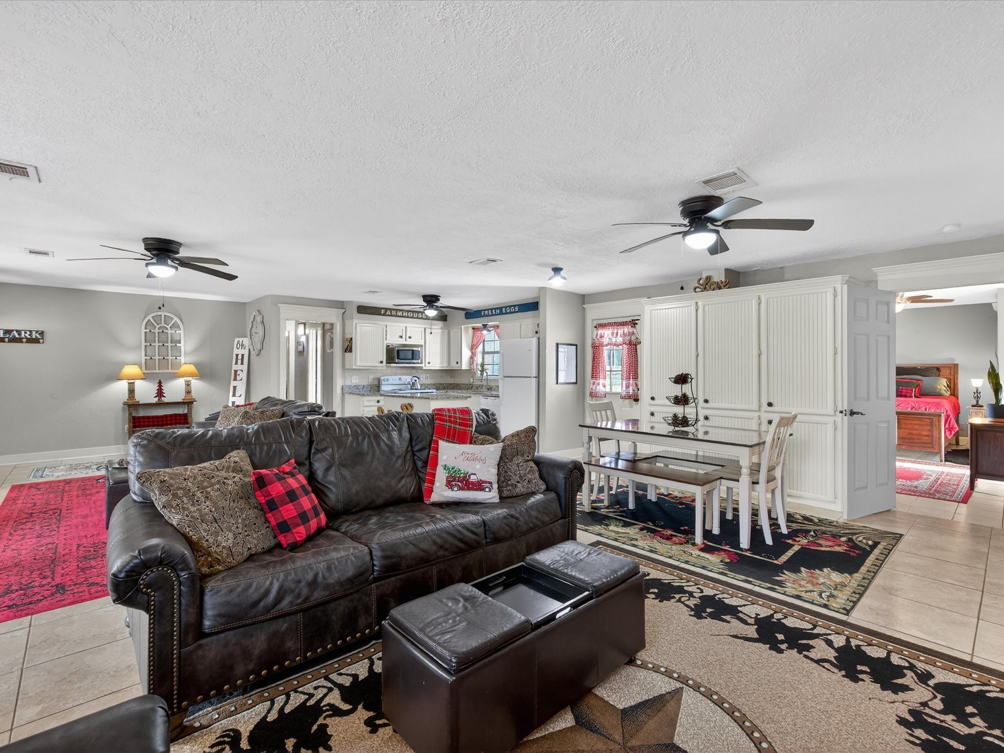 10277 Champion Forest Loop Conroe, TX 77303 - Photo 19 of 45 a living room with furniture kitchen view and a table