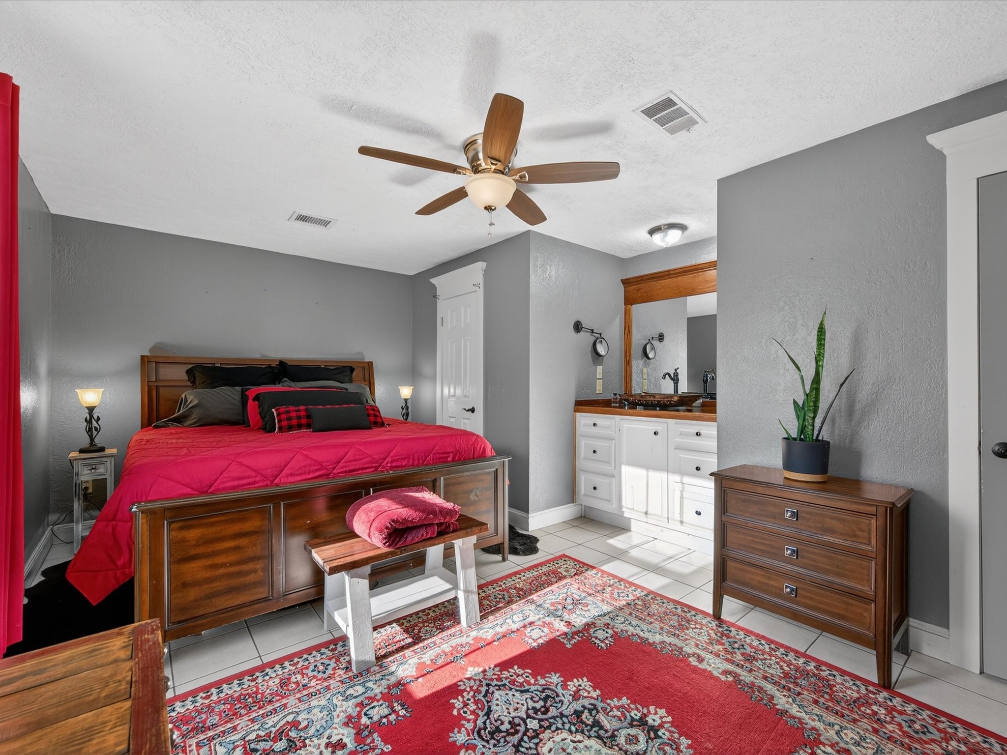 10277 Champion Forest Loop Conroe, TX 77303 - Photo 26 of 45 a bedroom with a bed and furniture