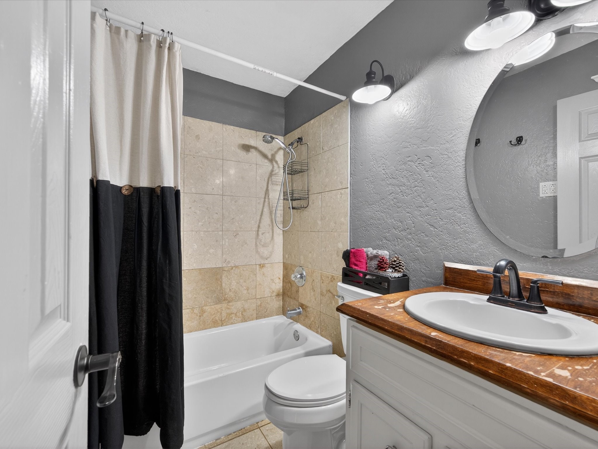 10277 Champion Forest Loop Conroe, TX 77303 - Photo 29 of 45 a bathroom with a granite countertop sink a toilet and shower