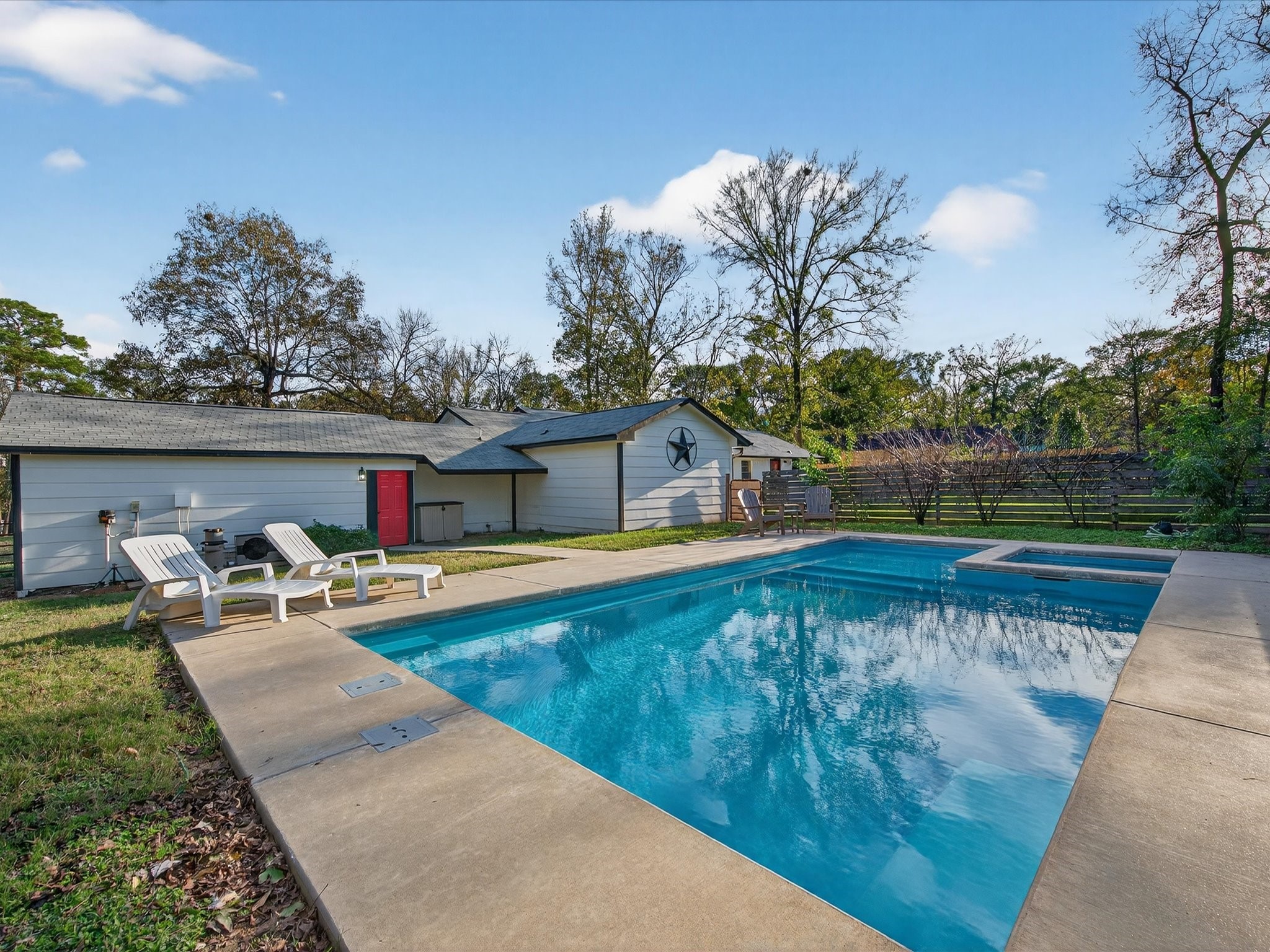 10277 Champion Forest Loop Conroe, TX 77303 - Photo 38 of 45 swimming pool with outdoor seating and yard