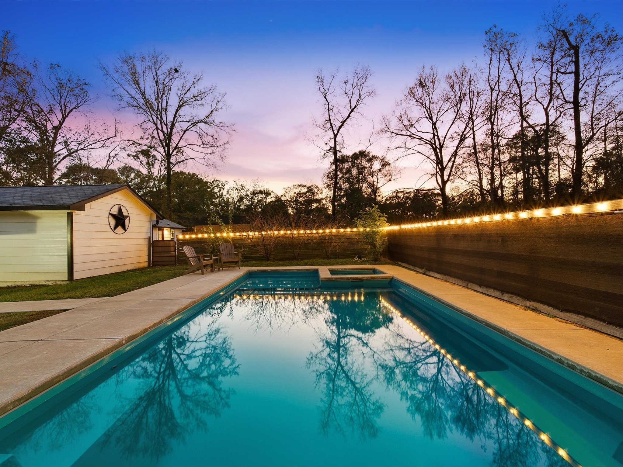 10277 Champion Forest Loop Conroe, TX 77303 - Photo 7 of 45 a view of swimming pool from a lake