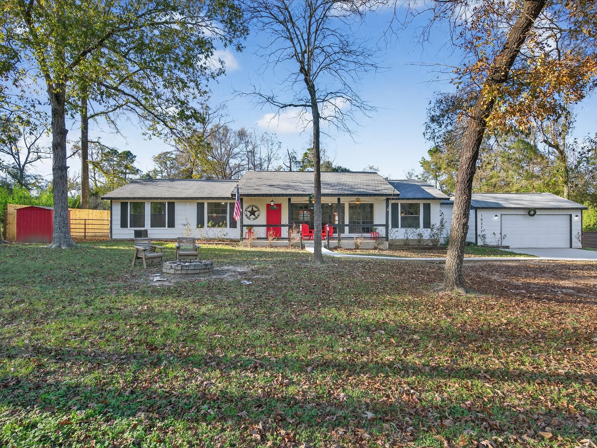 10277 Champion Forest Loop Conroe, TX 77303 - Photo 10 of 45 front view of a house with a yard