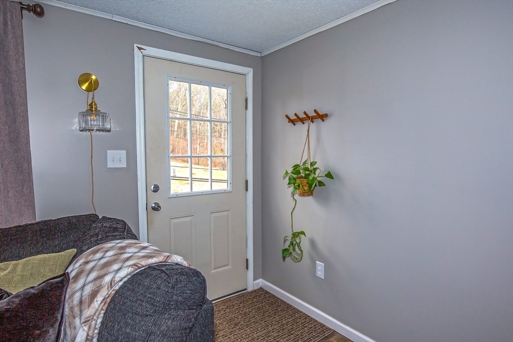 4498 High Street Palmer, MA 01069 - Photo 12 of 26 a bedroom with a bed and a window