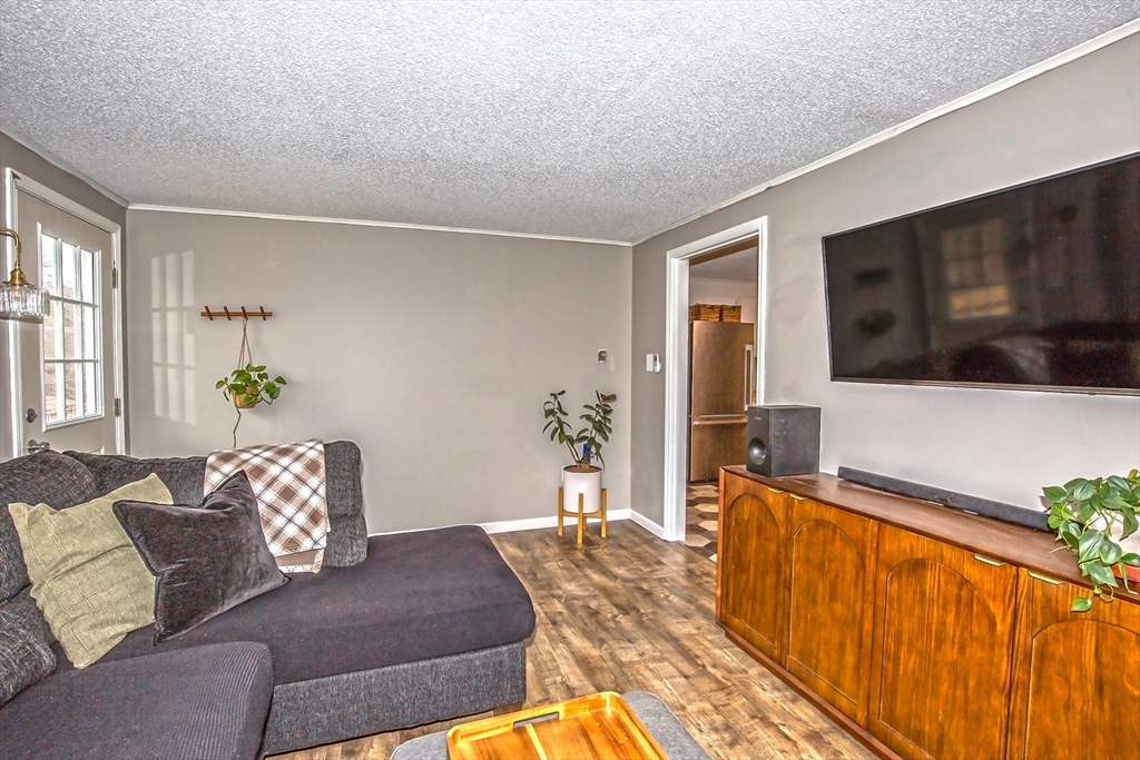 4498 High Street Palmer, MA 01069 - Photo 15 of 26 a living room with furniture fireplace and flat screen tv