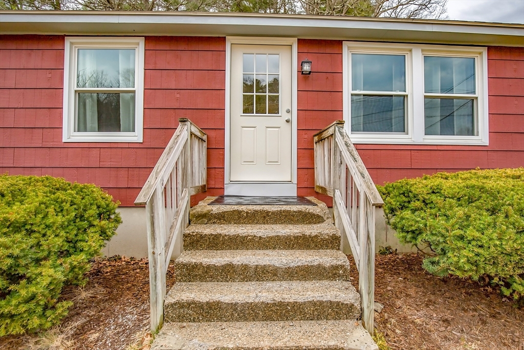4498 High Street Palmer, MA 01069 - Photo 4 of 26 a view of a house with a window and stairs