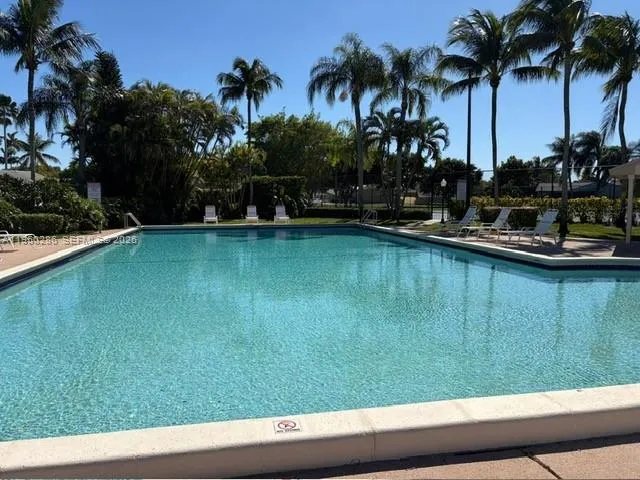 a view of a playground with basketball court
