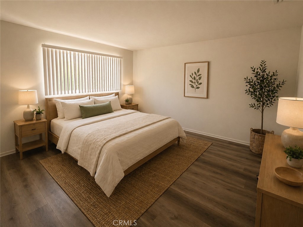 73740 Santa Rosa Way, Unit 5 Palm Desert, CA 92260 - Photo 3 of 20 a bedroom with a bed and a potted plant